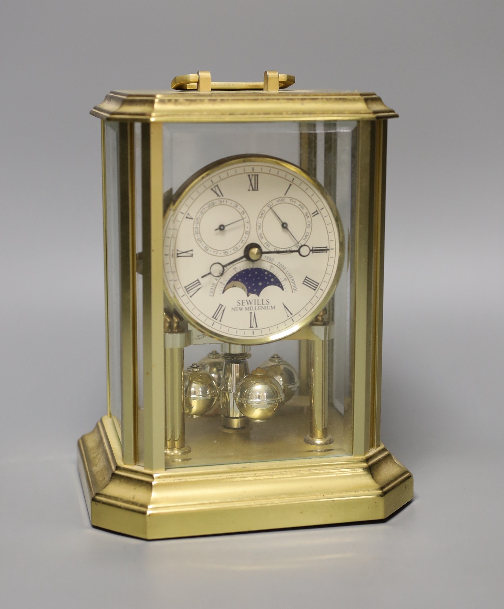 A four glass Sewells 400 day clock, 20cm high.